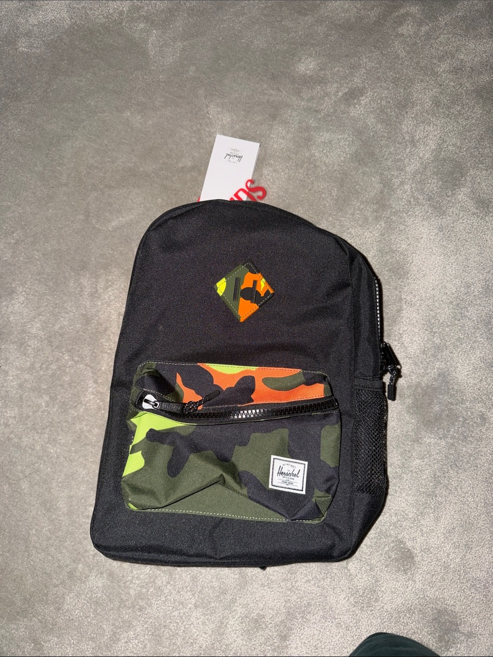 Herschel Supply Company Black Backpack with Green & Orange Camo Accents